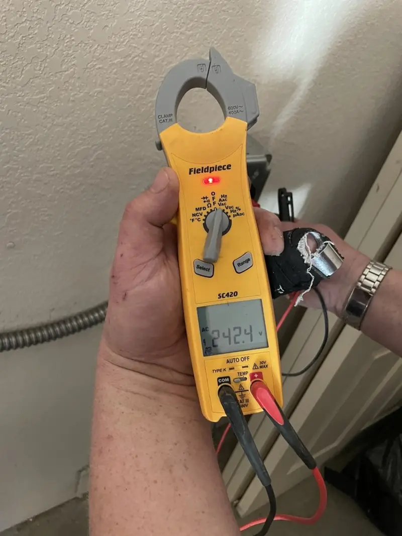 Voltage testing with clamp meter during Generator Installation in Brady
